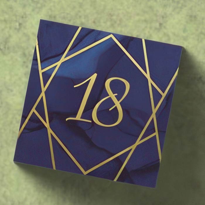 Elegant 18th Birthday Napkins featuring a gold geometric design on a dark background for sophisticated celebrations