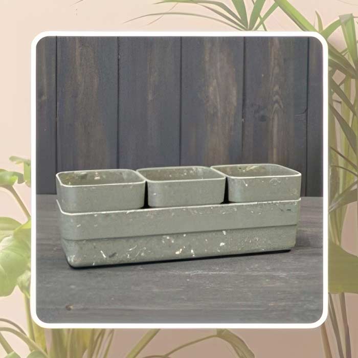 Stylish bamboo plant pot set in muted grey, perfect for home or office decor