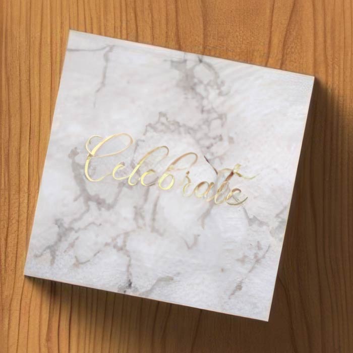 Elegant grey napkin with a gold script 'Celebrate' for weddings and formal occasions