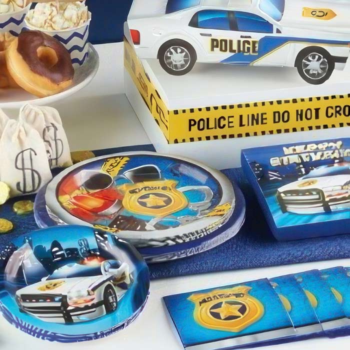 Police Birthday Party Supplies including themed plates, decorations, and a police car centerpiece