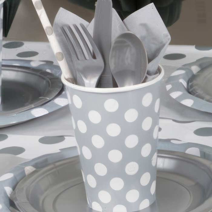 Stylish Silver Party Supplies featuring polka dot cups, plates, and utensils for a modern celebration