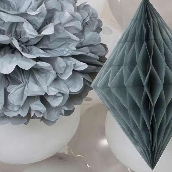Elegant silver party decorations with foil and honeycomb designs perfect for weddings and celebrations