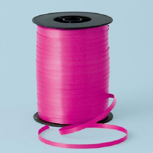 A reel of magenta curling ribbon.